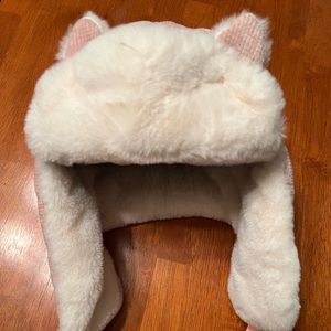Adorable and warm girls’ winter hat with fur and cat ear accents.